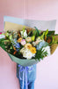 A beautiful pastel bunch of seasonal flowers made fresh to order by our floral designers